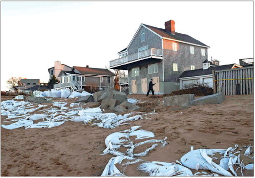 Nor’easter shredded many of the heavy sand-filled plastic bags placed on the beach along Reservation Terrace